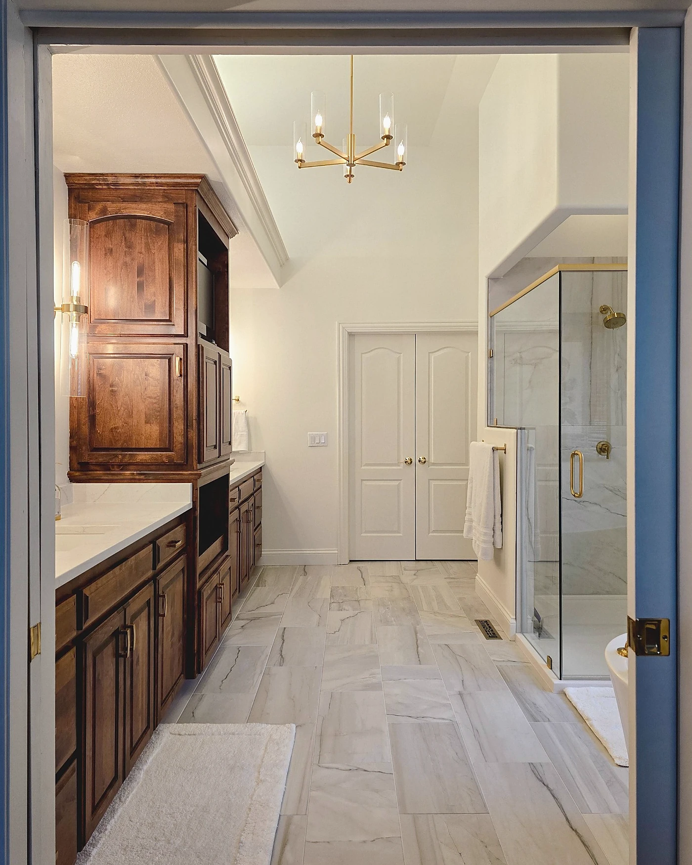 Custom double bathroom vanity with wood cabinetry, premium countertop, and elegant mirrors