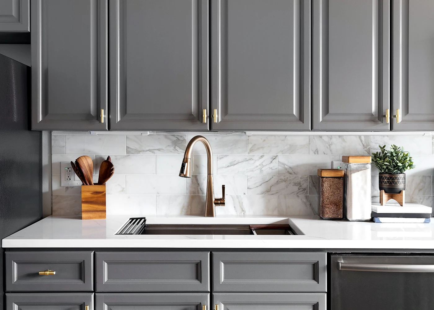 Easy access kitchen cabinets and drawers with large hardware, sink work zone, and bright countertop