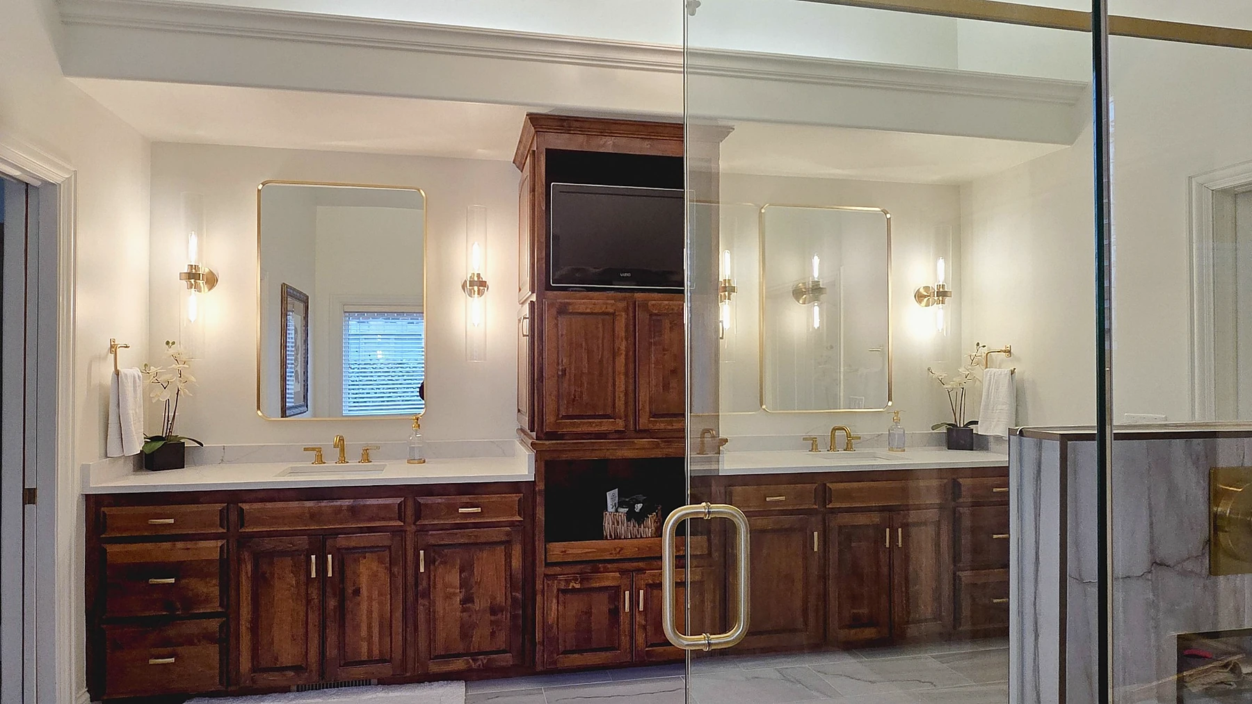 Wide view of luxury universal design bathroom with custom vanity and glass shower