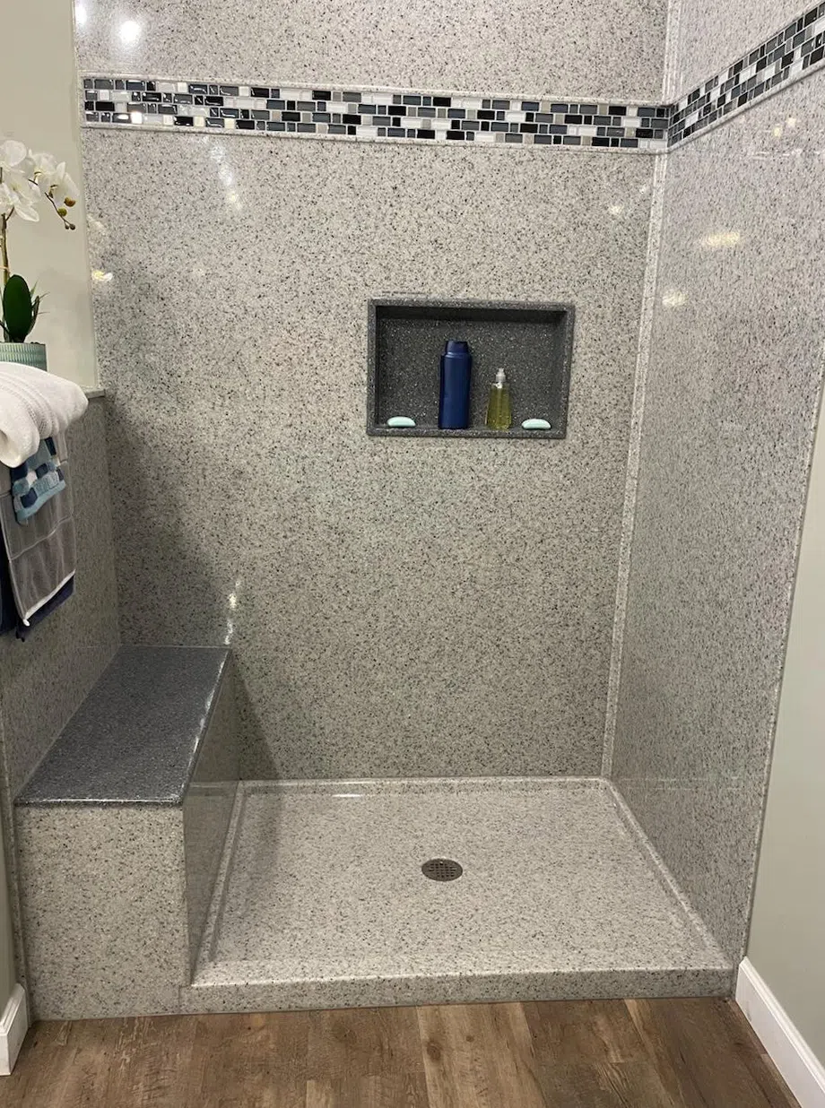 Recessed shower shelf and clean shower surface detail for Onyx shower system planning